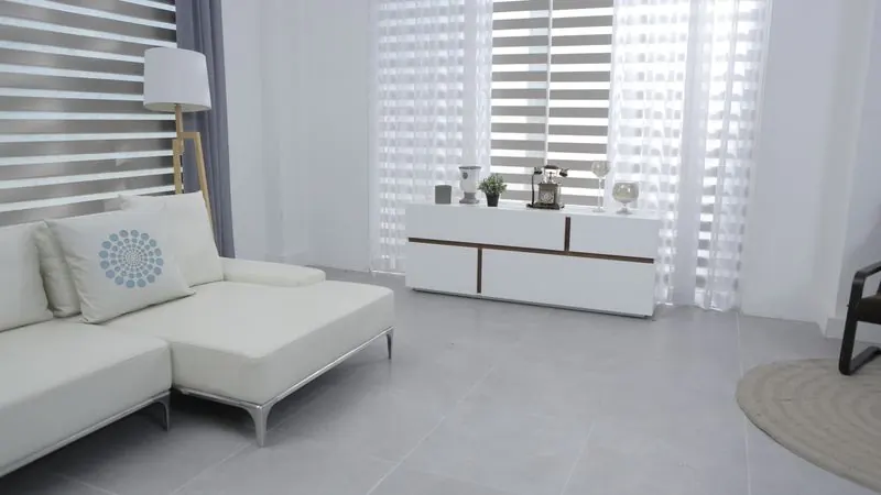 Clean spacious minimalist home interior with white sofa, sleek furniture and bright neutral decor